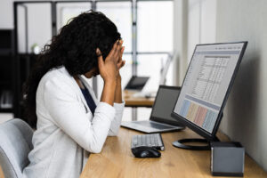 Image of a business woman experiencing work anxiety in Reading, PA. Showing someone who could benefit from therapy as a form of anxiety treatment in Pennsylvania.